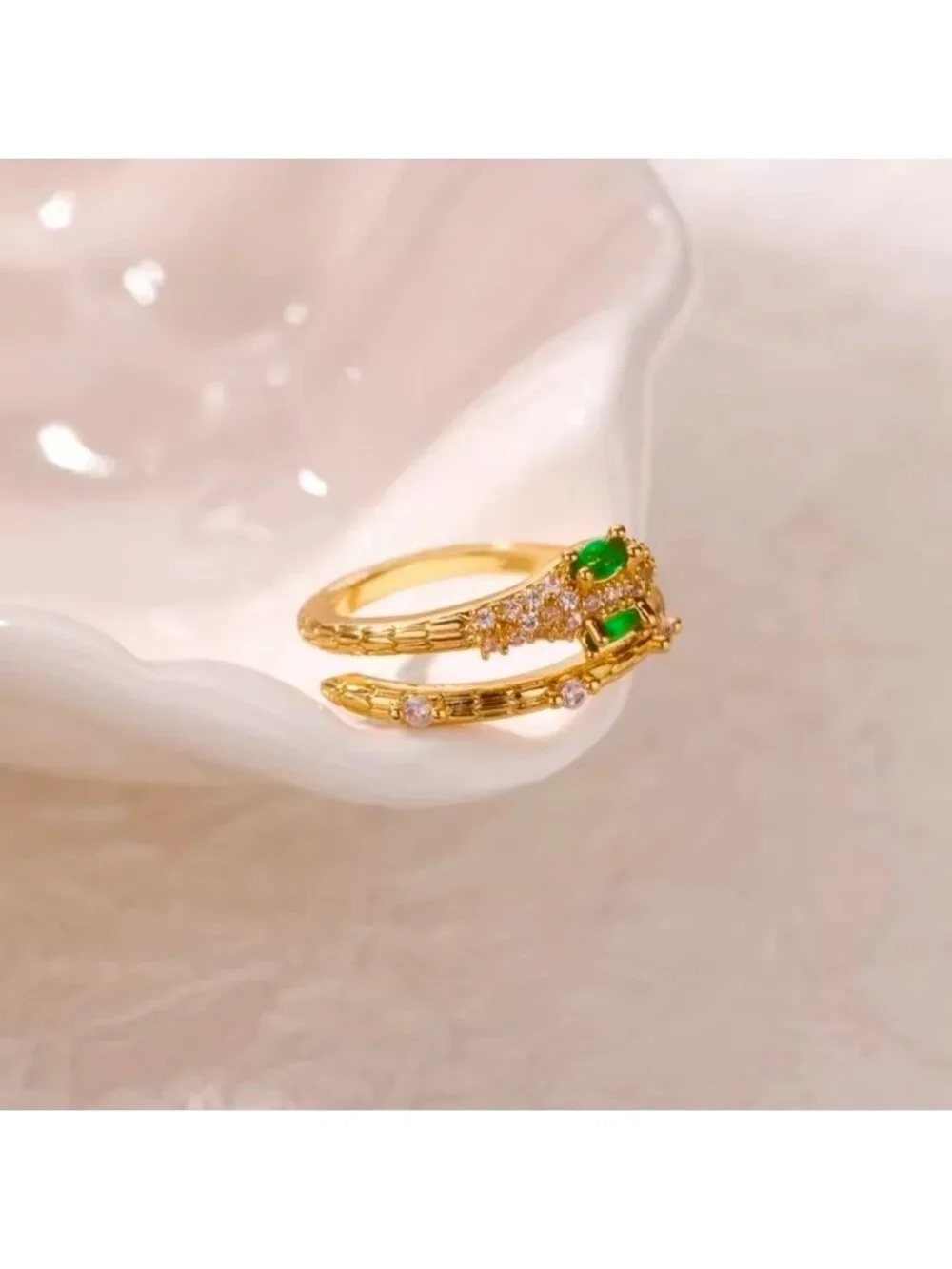 Gold Snake Ring with Emerald Accents